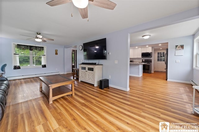2777 S Roberts Rd, Sheridan, NY 14063 - living room featuring a ceiling fan, a baseboard radiator, and light wood-style flooring