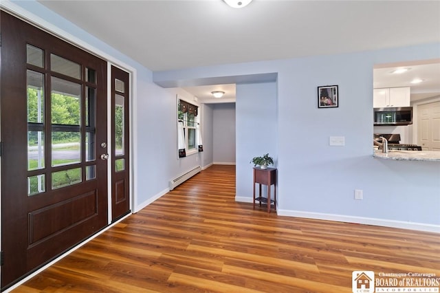 2777 S Roberts Rd, Sheridan, NY 14063 - foyer entrance with wood finished floors and baseboard heating