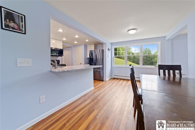 2777 S Roberts Rd, Sheridan, NY 14063 - unfurnished dining area with a baseboard heating unit, light wood finished floors, and recessed lighting