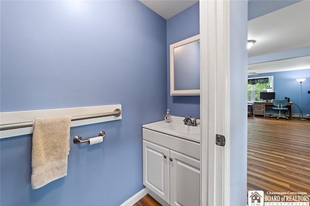 2777 S Roberts Rd, Sheridan, NY 14063 - bathroom with vanity and wood finished floors