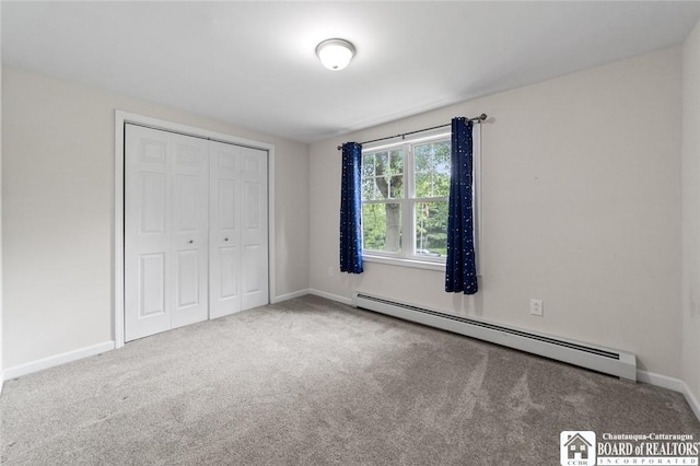 2777 S Roberts Rd, Sheridan, NY 14063 - unfurnished bedroom featuring baseboard heating, carpet floors, and a closet