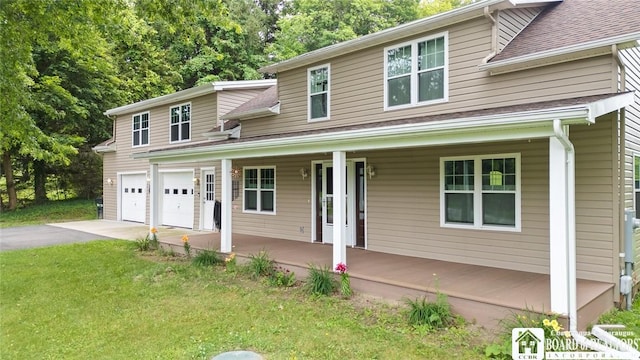 2777 S Roberts Rd, Sheridan, NY 14063 - view of front facade with covered porch, asphalt driveway, a front yard, and a shingled roof