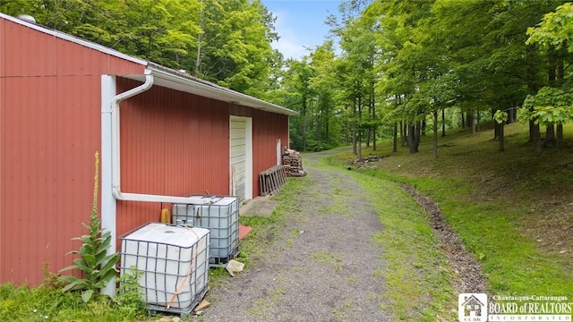 2777 S Roberts Rd, Sheridan, NY 14063 - view of property exterior with an outbuilding and a garage