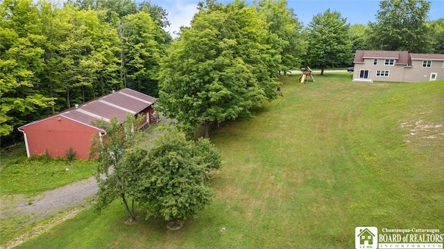2777 S Roberts Rd, Sheridan, NY 14063 - view of green lawn featuring a pole building and an outbuilding