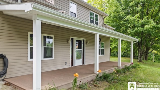 2777 S Roberts Rd, Sheridan, NY 14063 - wooden porch featuring a yard