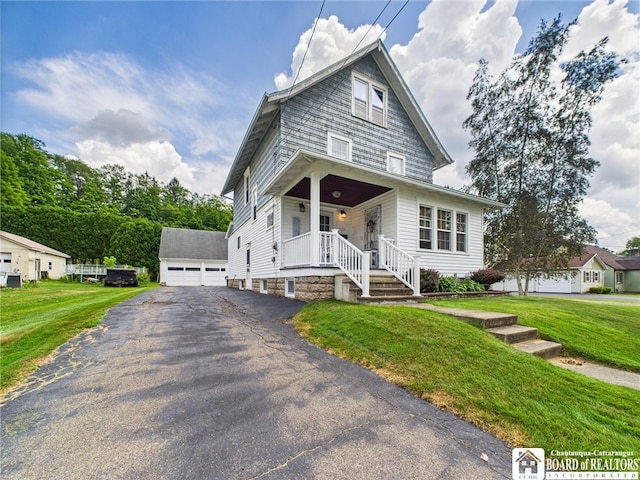 118 N 3rd St, Allegany, NY 14706 - traditional style home with a front lawn, covered porch, and a detached garage