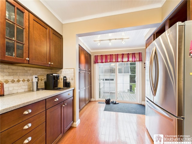118 N 3rd St, Allegany, NY 14706 - kitchen featuring freestanding refrigerator, light wood-style floors, crown molding, glass insert cabinets, and tasteful backsplash