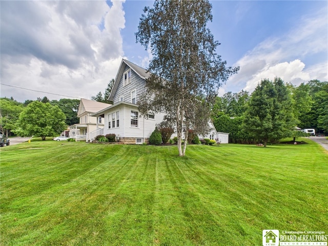 118 N 3rd St, Allegany, NY 14706 - view of home's exterior featuring a lawn