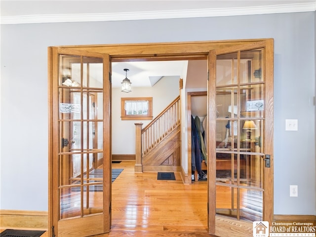 118 N 3rd St, Allegany, NY 14706 - foyer entrance featuring french doors, wood finished floors, stairway, and ornamental molding