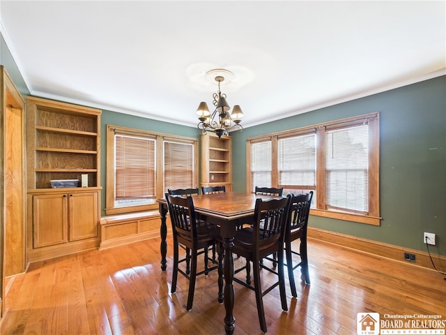 118 N 3rd St, Allegany, NY 14706 - dining space featuring a chandelier, ornamental molding, and light wood-style floors