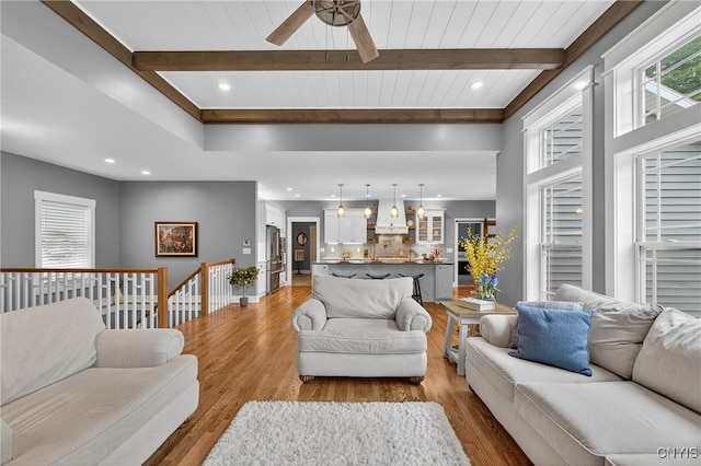 8873 Salvatore Ave, Lysander, NY 13027 - living area featuring beam ceiling, wood finished floors, a ceiling fan, and recessed lighting