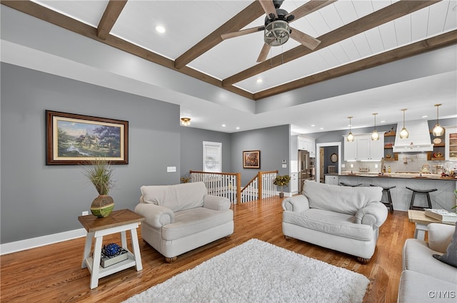8873 Salvatore Ave, Lysander, NY 13027 - living area featuring beamed ceiling, wood finished floors, recessed lighting, and a ceiling fan