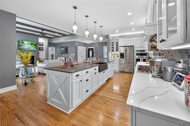 8873 Salvatore Ave, Lysander, NY 13027 - kitchen featuring appliances with stainless steel finishes, ceiling fan, white cabinets, light wood-type flooring, and recessed lighting