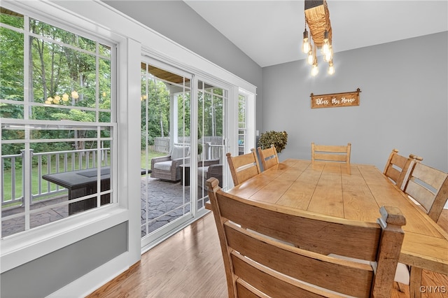 8873 Salvatore Ave, Lysander, NY 13027 - dining area featuring wood finished floors and a chandelier