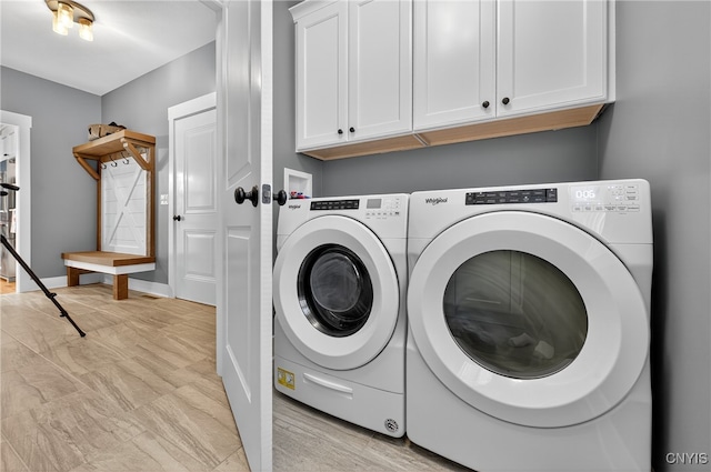 8873 Salvatore Ave, Lysander, NY 13027 - laundry room featuring cabinet space and washer and dryer