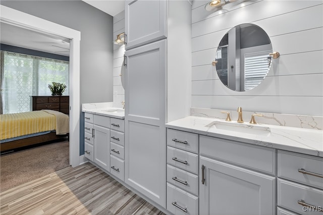 8873 Salvatore Ave, Lysander, NY 13027 - full bathroom with vanity and wood finished floors