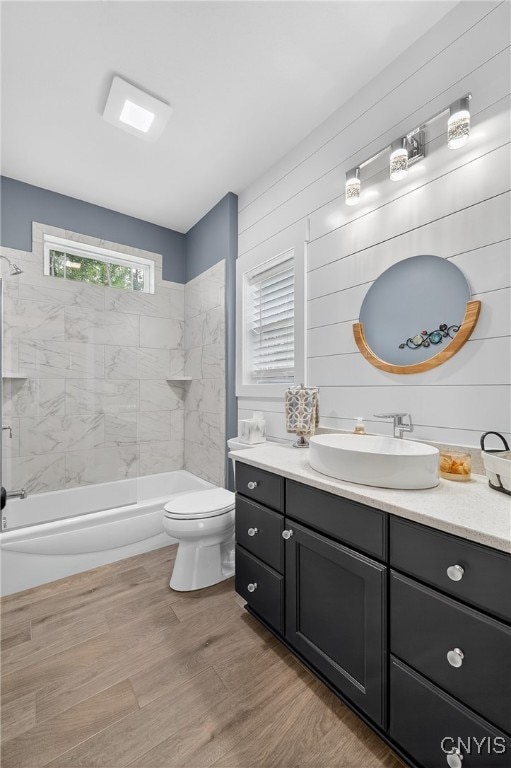 8873 Salvatore Ave, Lysander, NY 13027 - full bathroom with vanity, shower / washtub combination, and wood finished floors