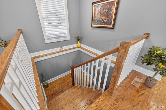 8873 Salvatore Ave, Lysander, NY 13027 - stairway with wood finished floors and baseboards