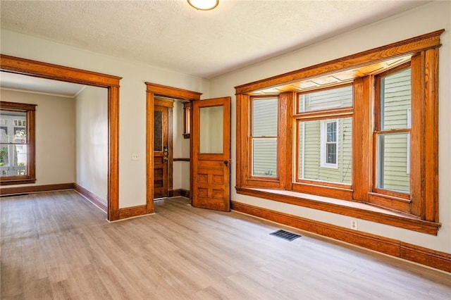 9 Englert St, Rochester, NY 14605 - empty room with light wood-type flooring and a textured ceiling