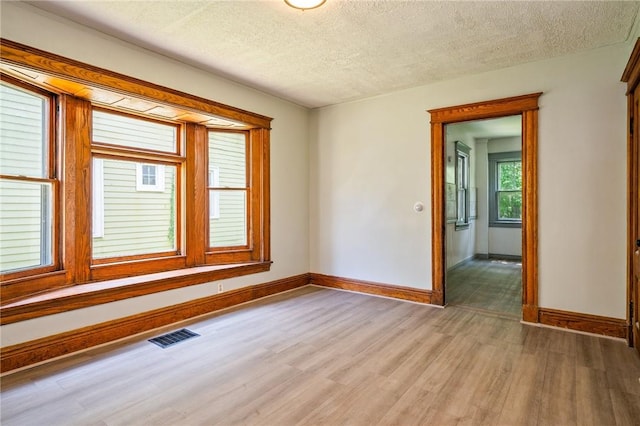 9 Englert St, Rochester, NY 14605 - spare room featuring light wood finished floors and a textured ceiling