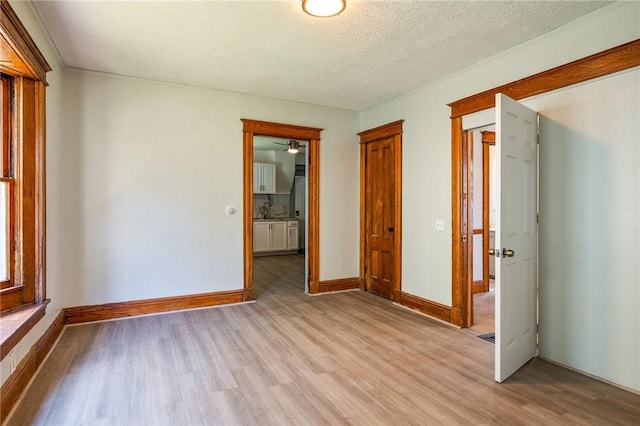 9 Englert St, Rochester, NY 14605 - spare room with light wood-type flooring and a textured ceiling