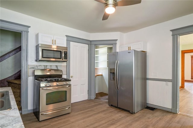 9 Englert St, Rochester, NY 14605 - kitchen featuring appliances with stainless steel finishes, a ceiling fan, light countertops, light wood-style flooring, and white cabinetry
