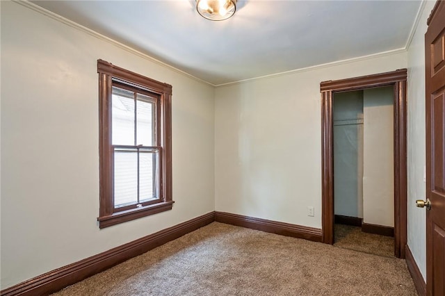 9 Englert St, Rochester, NY 14605 - unfurnished bedroom featuring carpet, crown molding, and a closet