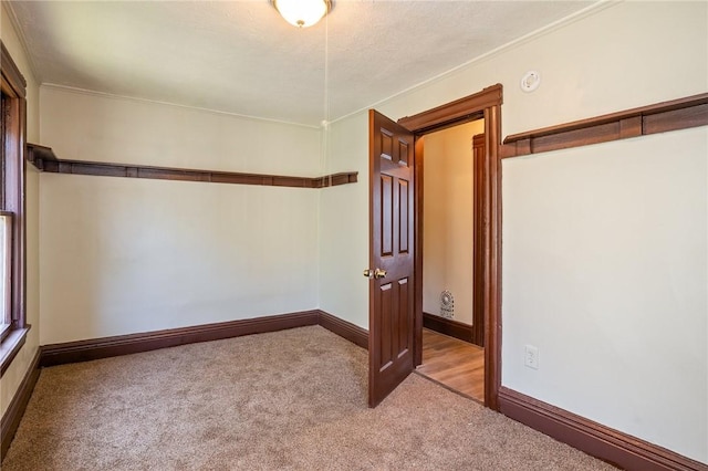 9 Englert St, Rochester, NY 14605 - empty room featuring carpet flooring, a smoke detector, and crown molding