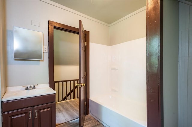 9 Englert St, Rochester, NY 14605 - bathroom featuring wood finished floors, vanity, ornamental molding, and washtub / shower combination