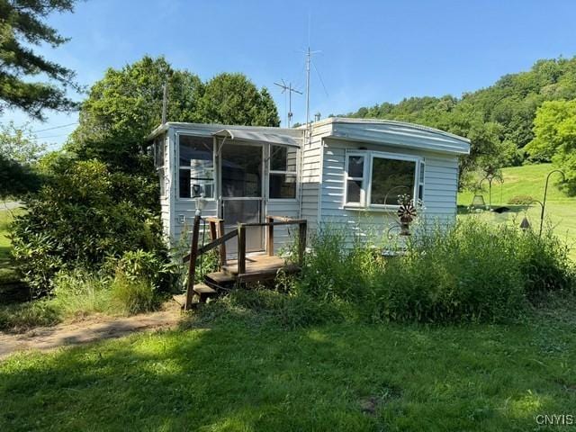 6792 Creek Rd, Lincoln, NY 13421 - rear view of house with a yard