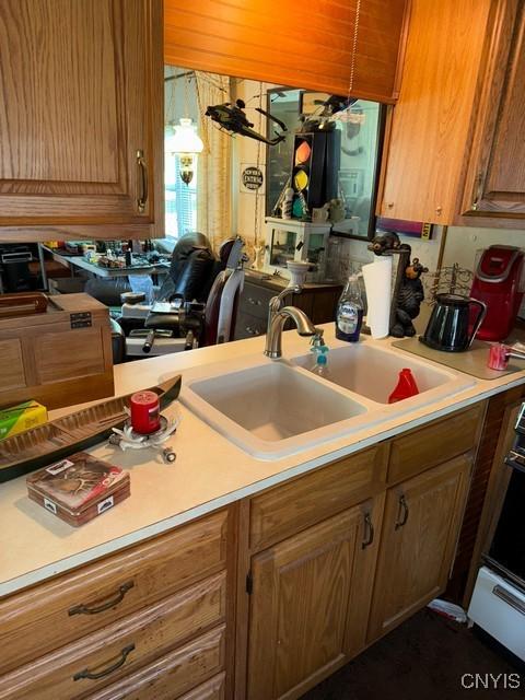 6792 Creek Rd, Lincoln, NY 13421 - kitchen with light countertops and brown cabinets