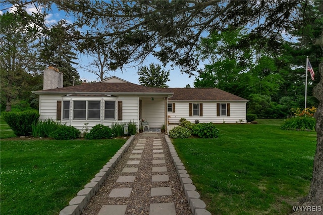 2610 Coomer Rd, Newfane, NY 14028 - view of front of house featuring a front lawn and a chimney