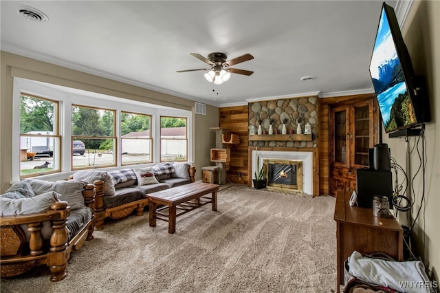 2610 Coomer Rd, Newfane, NY 14028 - living area featuring plenty of natural light, carpet floors, a ceiling fan, ornamental molding, and a fireplace