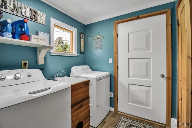 2610 Coomer Rd, Newfane, NY 14028 - laundry room featuring separate washer and dryer and wood finished floors