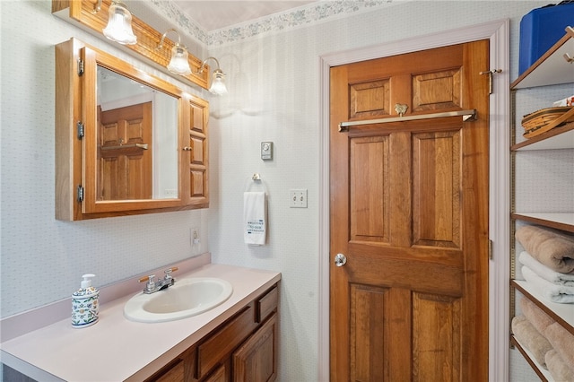 5041 Mapes Mathews Rd, Hector, NY 14818 - bathroom featuring wallpapered walls and vanity