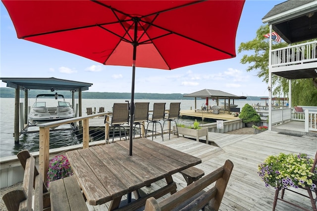 5041 Mapes Mathews Rd, Hector, NY 14818 - wooden terrace featuring boat lift, a water view, and a dock