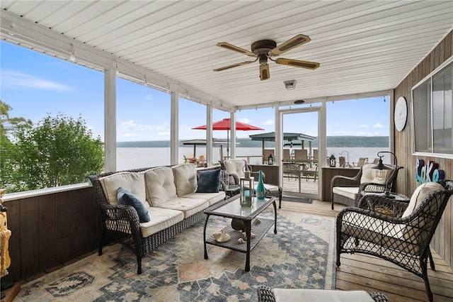 5041 Mapes Mathews Rd, Hector, NY 14818 - sunroom / solarium with wood finished floors and a water view