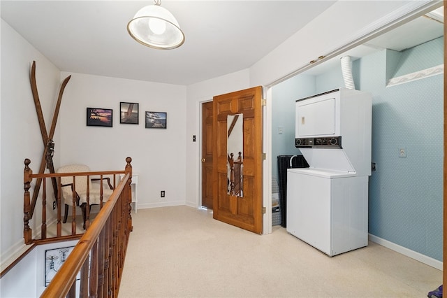 5041 Mapes Mathews Rd, Hector, NY 14818 - washroom featuring stacked washing machine and dryer and baseboards