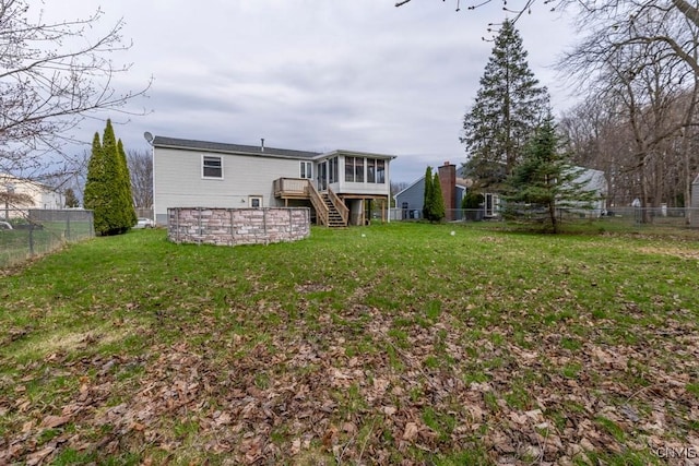 8405 Winterberry Way, Clay, NY 13090 - back of house with a sunroom, stairs, a fenced backyard, and a deck