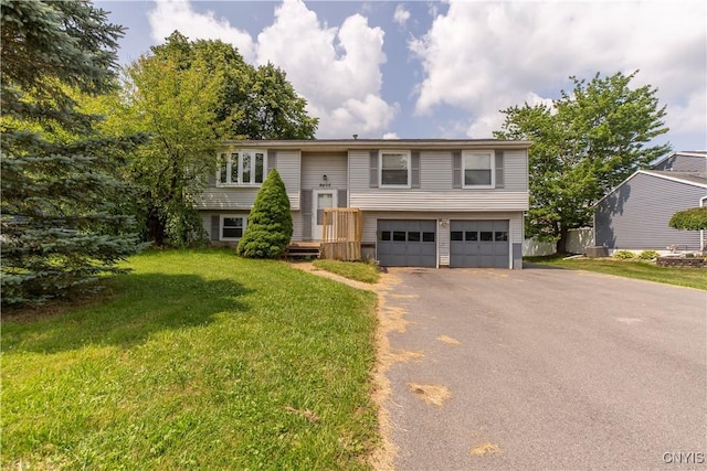 8405 Winterberry Way, Clay, NY 13090 - split foyer home with a garage, driveway, and a front yard