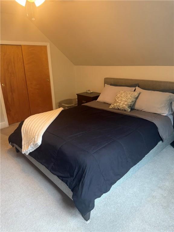 82 Winsor Cir, Elmira, NY 14905 - bedroom featuring carpet flooring, lofted ceiling, and a closet