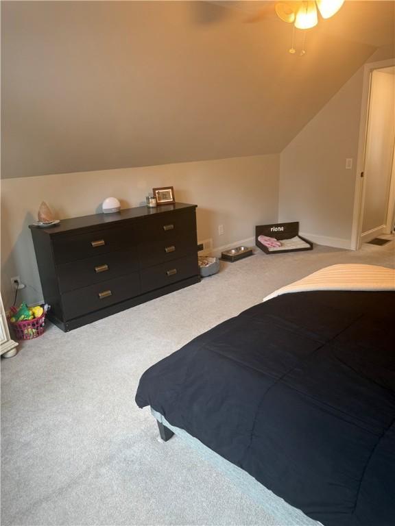 82 Winsor Cir, Elmira, NY 14905 - carpeted bedroom with vaulted ceiling and ceiling fan