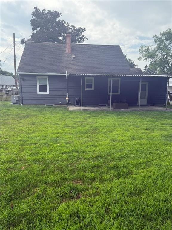 82 Winsor Cir, Elmira, NY 14905 - rear view of property featuring a patio area and a chimney