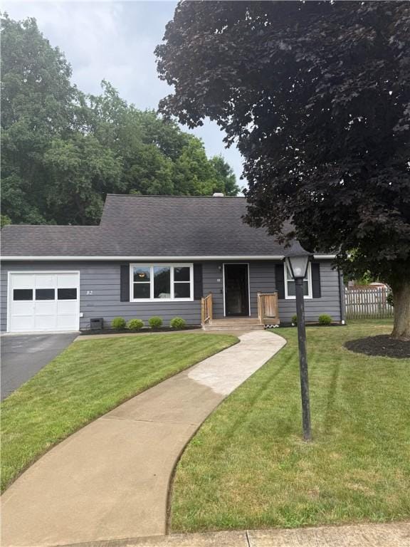 82 Winsor Cir, Elmira, NY 14905 - ranch-style house with an attached garage, asphalt driveway, and roof with shingles
