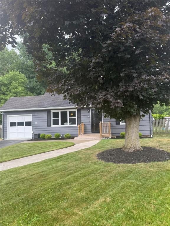 82 Winsor Cir, Elmira, NY 14905 - view of front of home with a garage, asphalt driveway, and a shingled roof