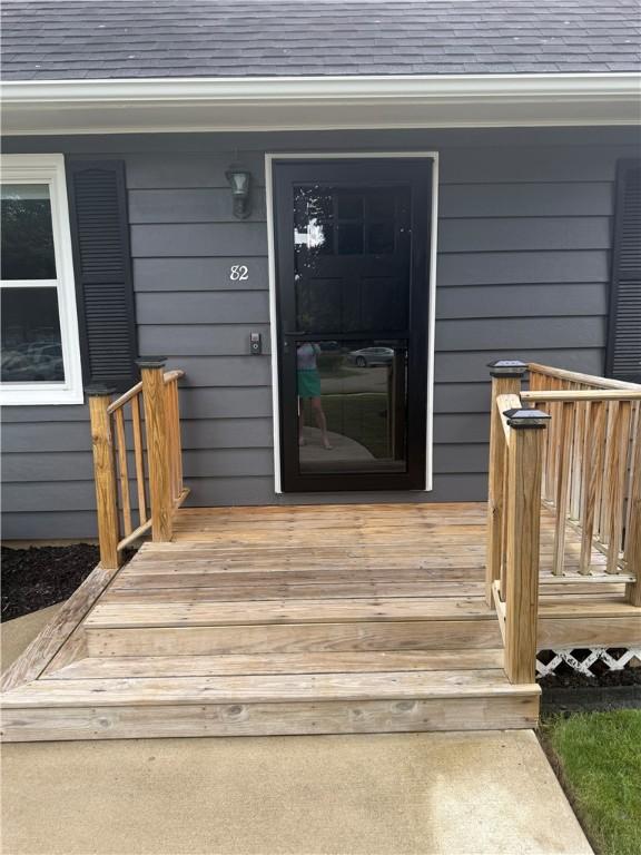 82 Winsor Cir, Elmira, NY 14905 - view of exterior entry with roof with shingles