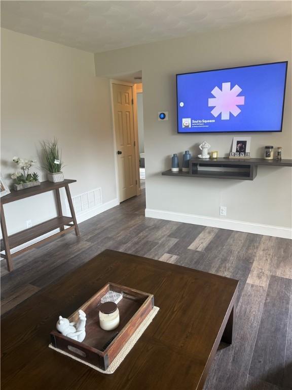 82 Winsor Cir, Elmira, NY 14905 - living room with wood finished floors and baseboards