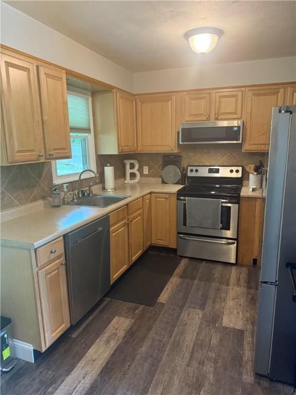 82 Winsor Cir, Elmira, NY 14905 - kitchen featuring appliances with stainless steel finishes, light countertops, dark wood-type flooring, and decorative backsplash