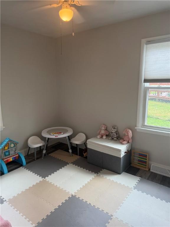 82 Winsor Cir, Elmira, NY 14905 - rec room featuring baseboards and a ceiling fan