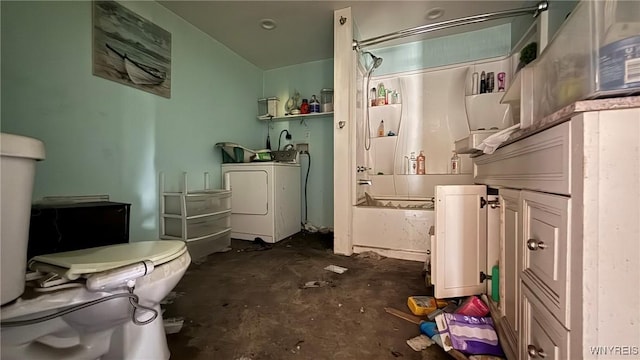 8713 Main St, Somerset, NY 14012 - bathroom featuring washer / clothes dryer, concrete floors, and shower / bath combo with shower curtain